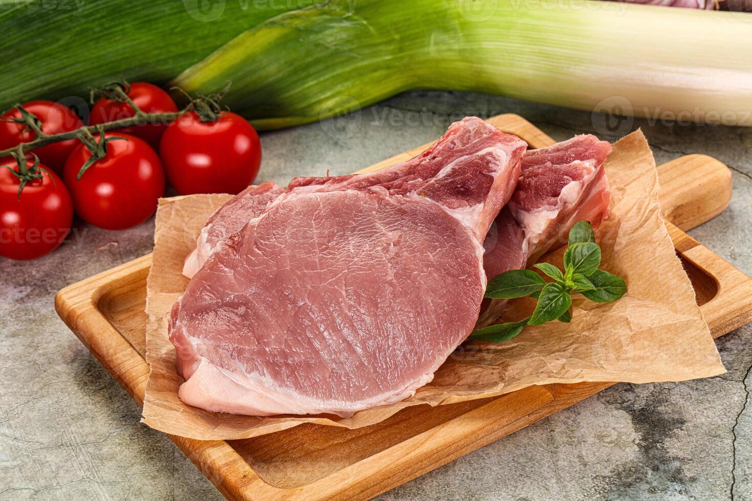 Raw pork steak loin with bone photo