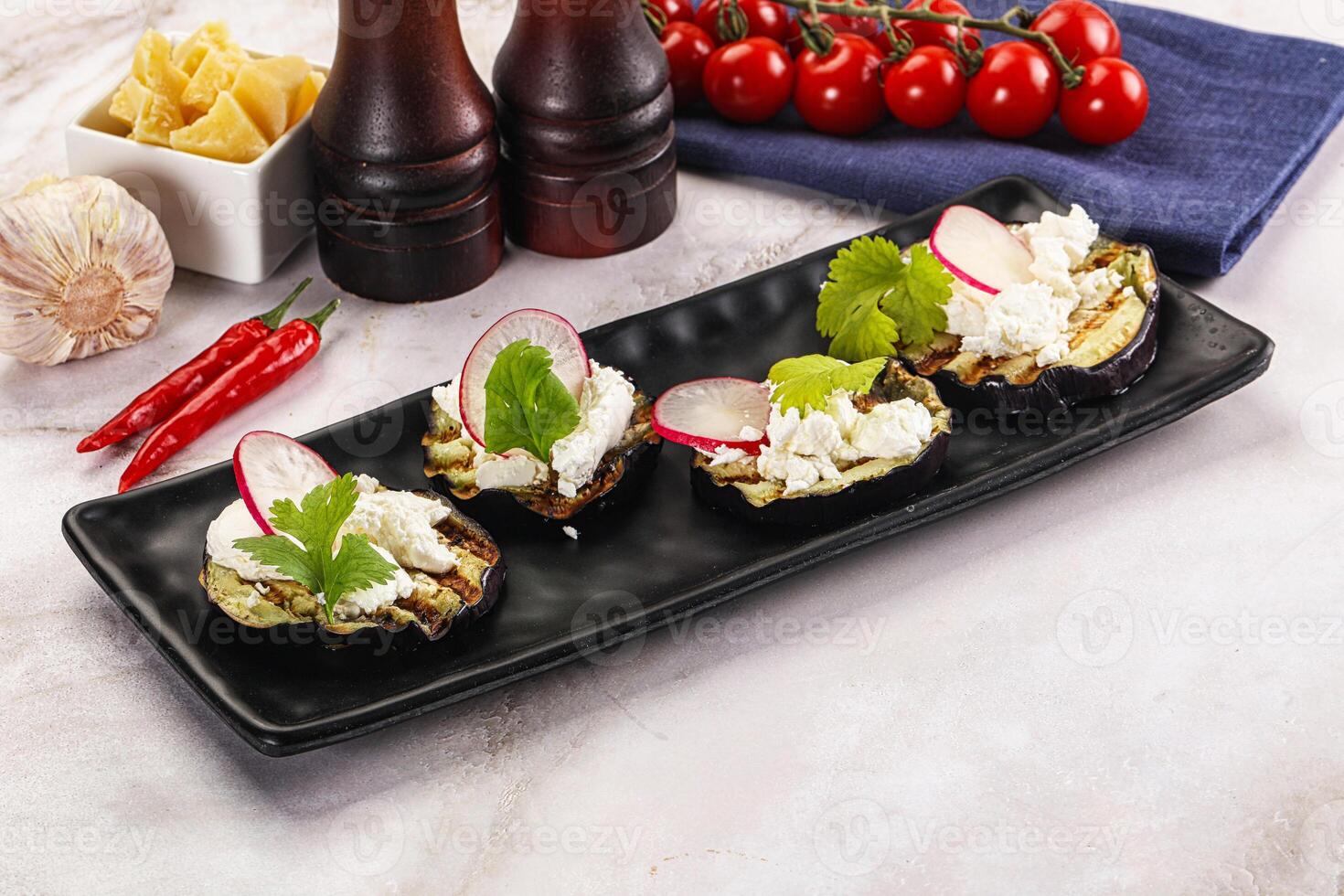 Grilled eggplant with cheese and radish photo