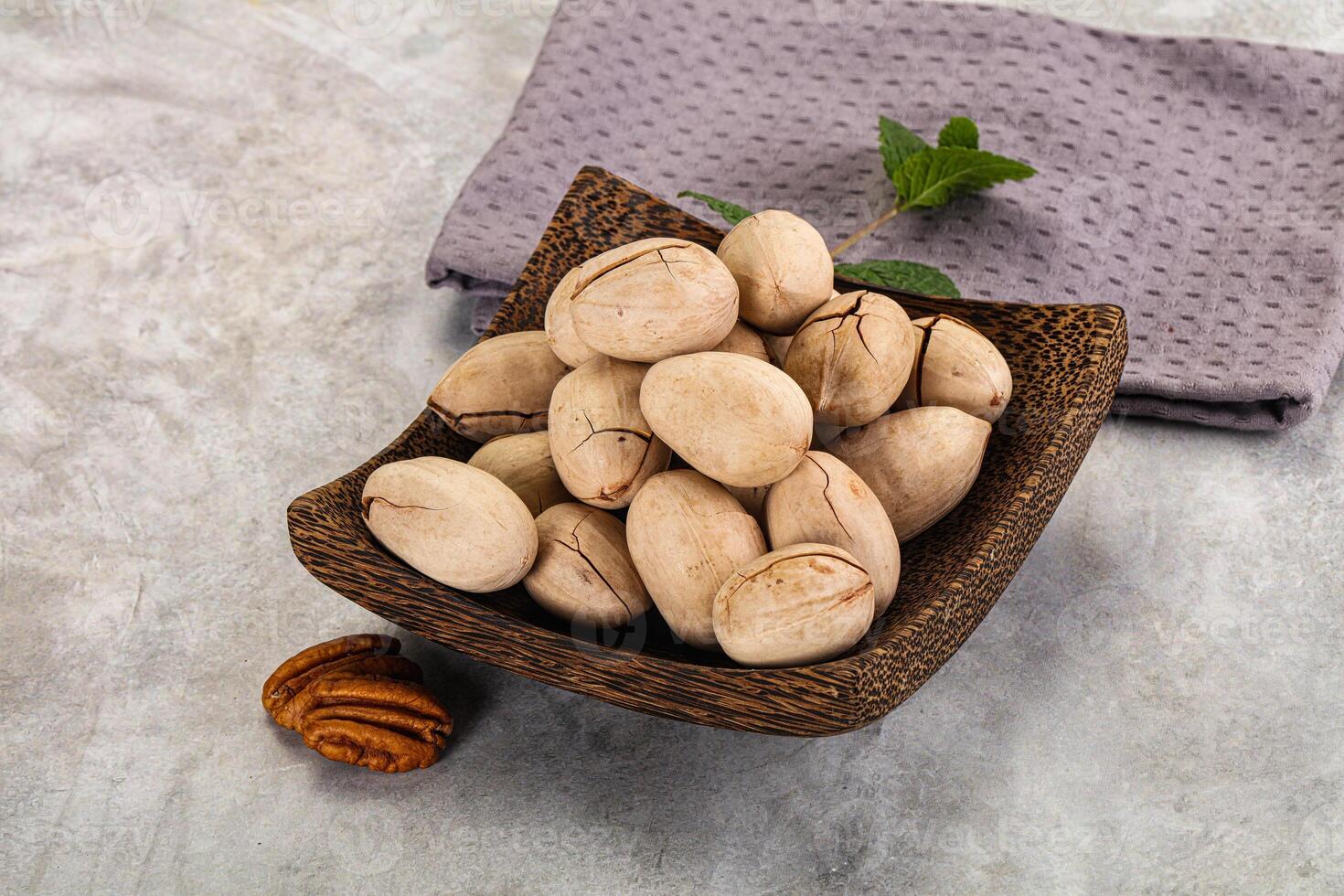 Crunchy pecan nut in the bowl photo