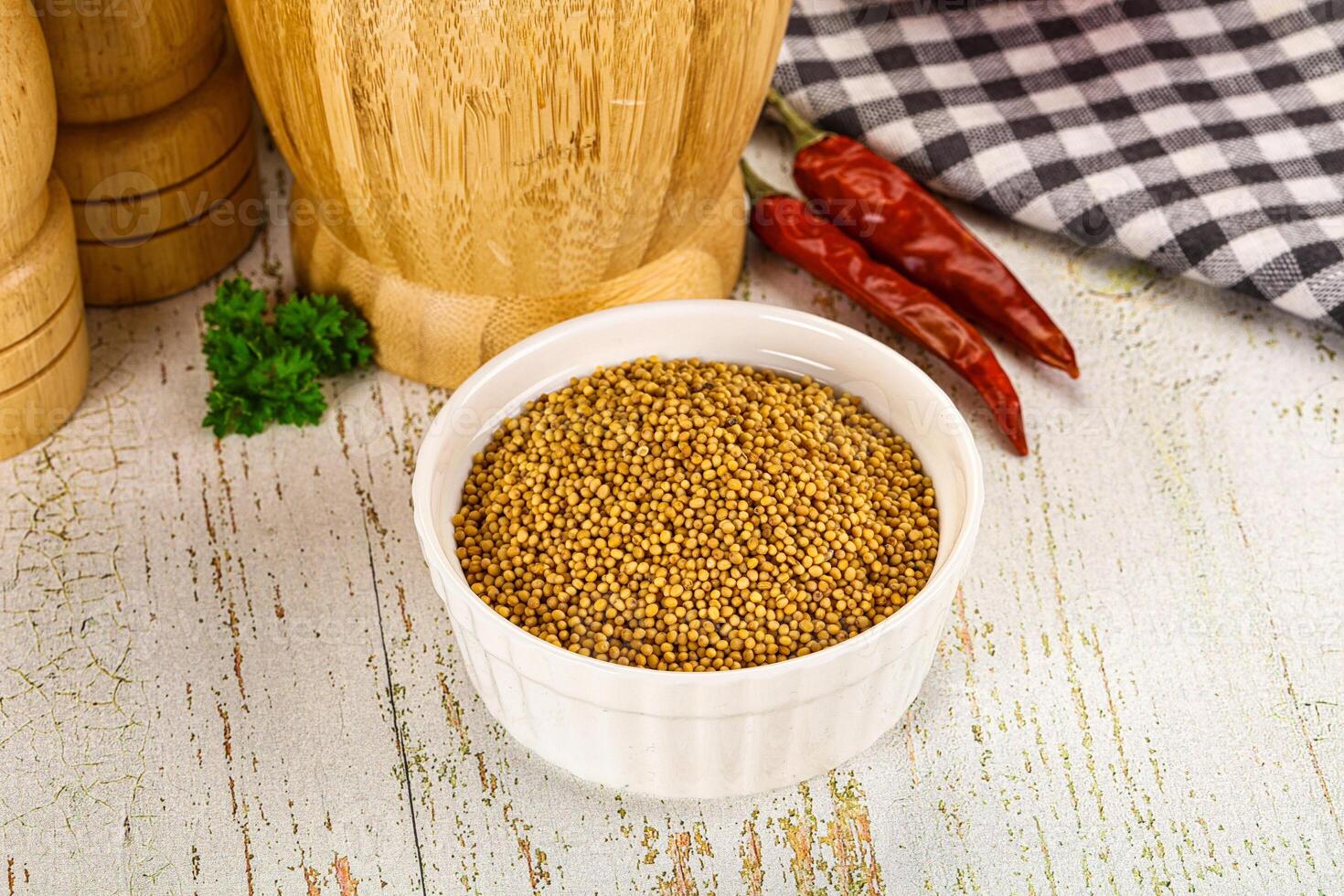 Dry mustard seeds in the bowl photo