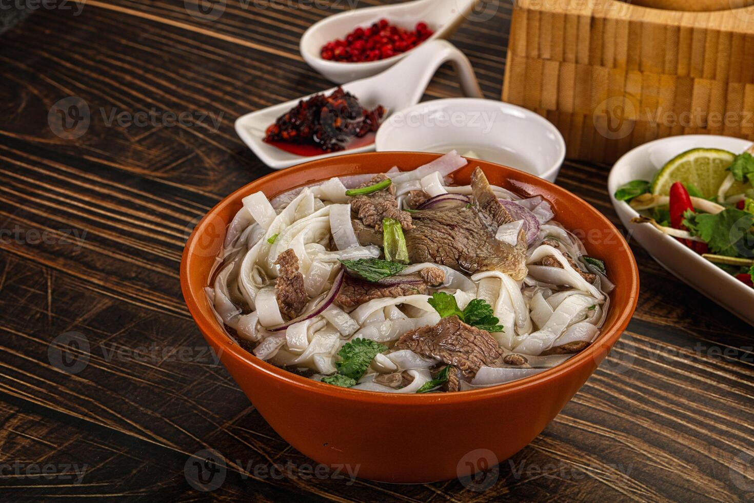 Vietnamese Pho Bo soup with beef and noodles photo