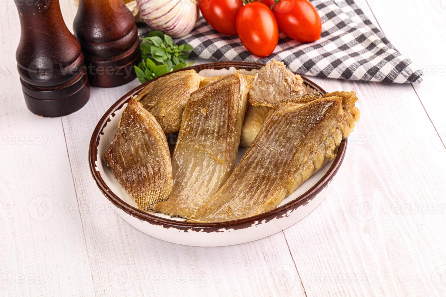 Baked stingray witngs with oil photo