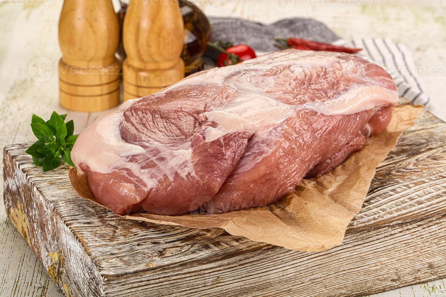 Raw pork meat piece for cooking photo