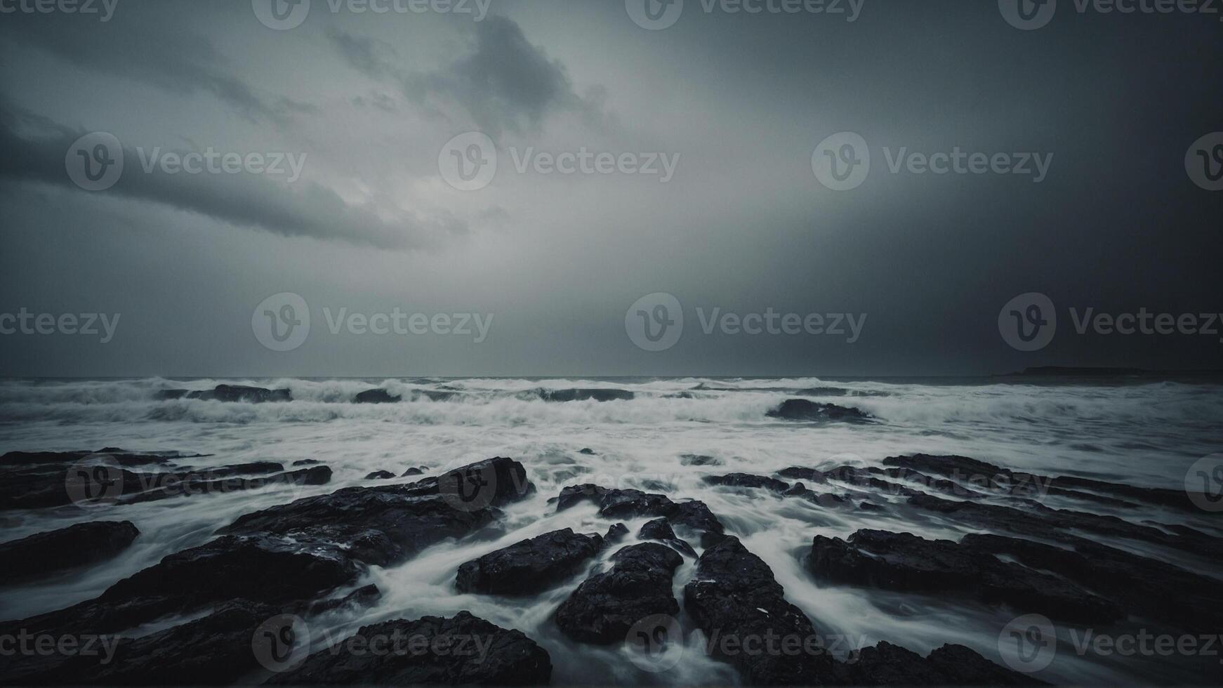 A stormy ocean with waves crashing against rocks photo