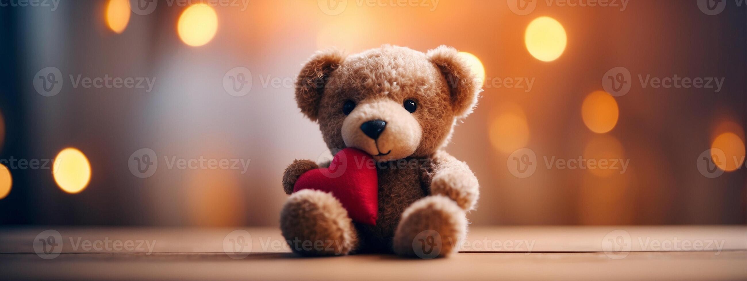 Teddy bear with heart on wooden table photo