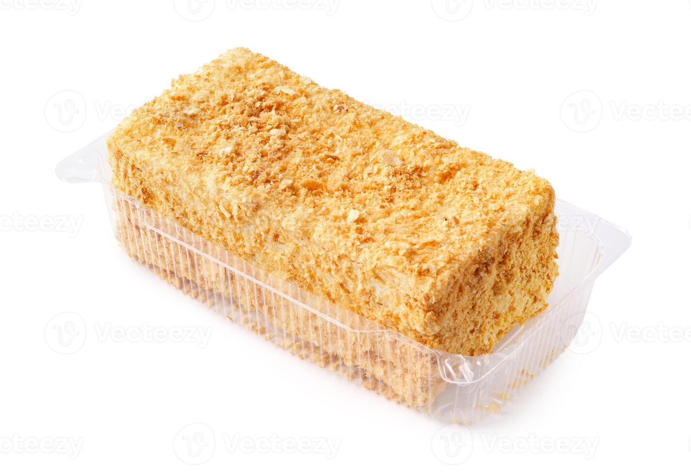 Layered dessert made with cake crumbs in a clear plastic container for a sweet treat photo