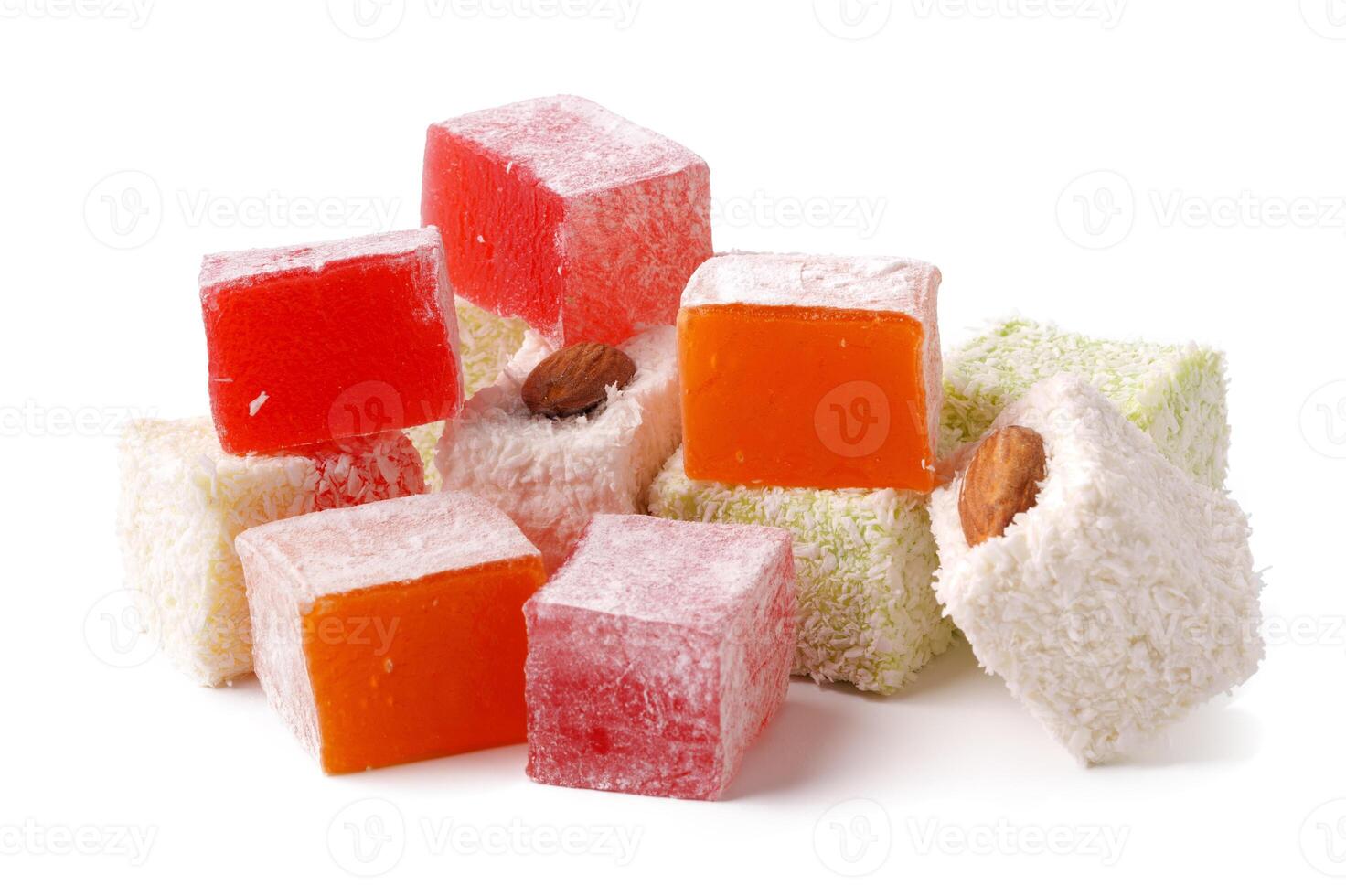 Colorful assortment of traditional Turkish delight with nuts displayed on a white background photo