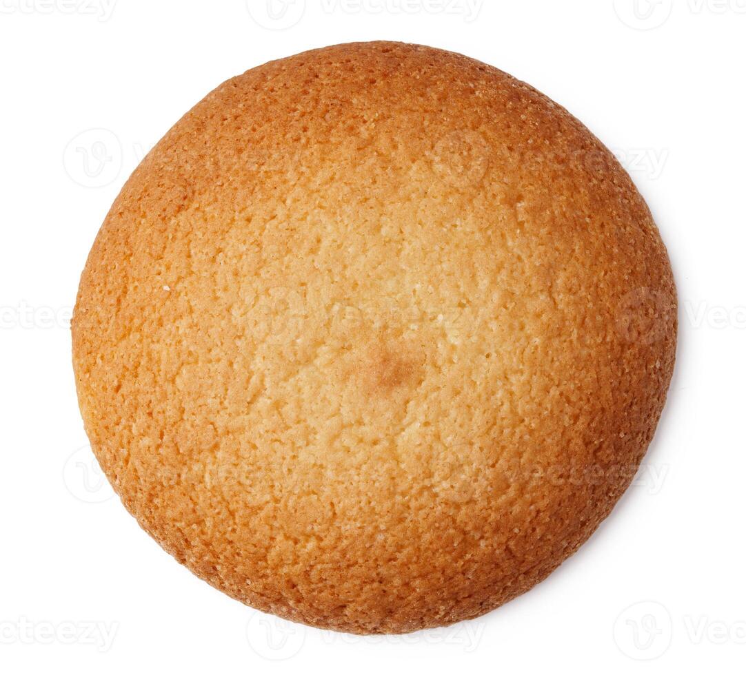 Round golden cookie displayed against a white background with a smooth texture and uniform shape perfect for desserts photo