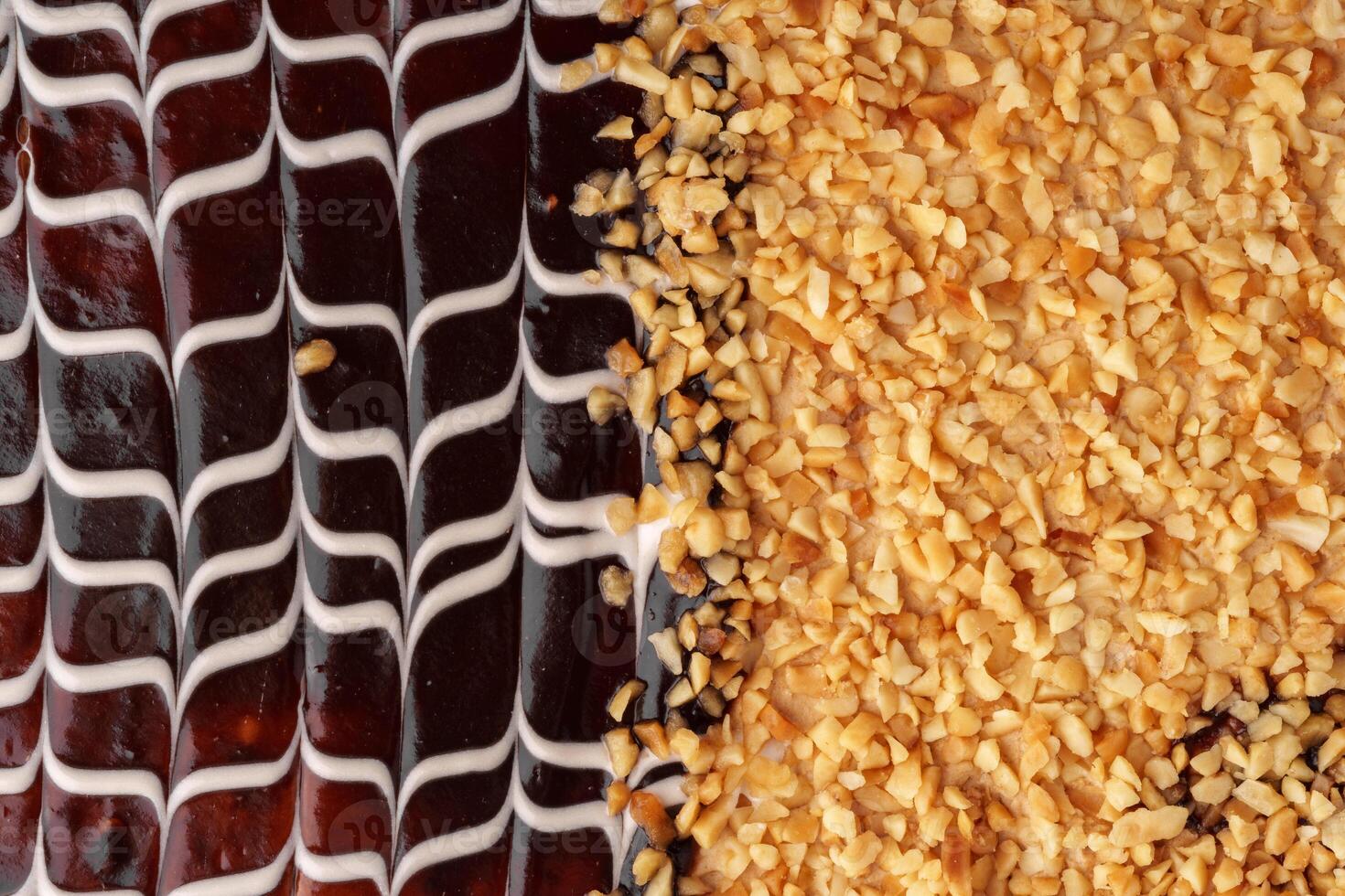 Chocolate dessert topped with crushed nuts showcases intricate design and delightful textures photo