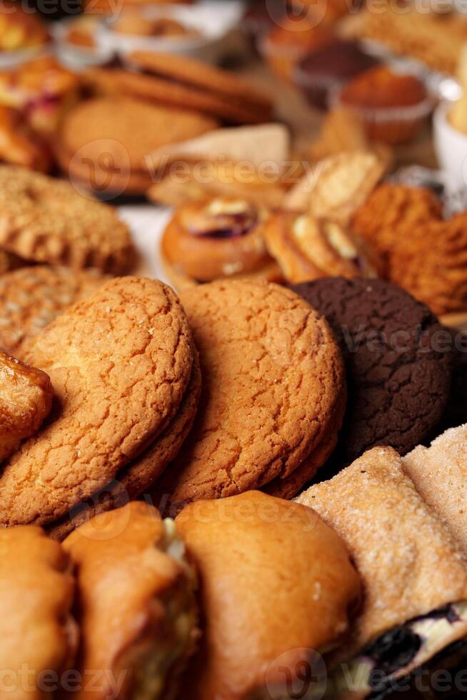 Assorted cookies displayed in a cozy bakery setting during a sunny afternoon photo