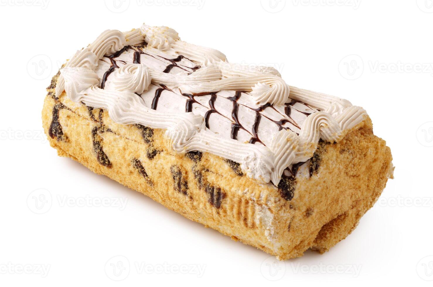 Delicious dessert log cake with cream frosting and chocolate drizzle served on a plain background photo