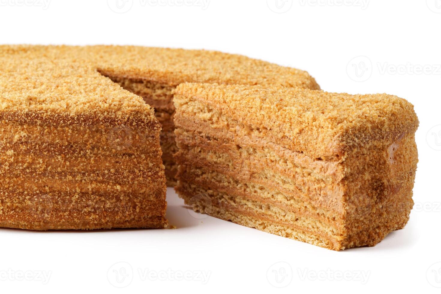 Delicious layered honey cake slice displayed on a clean surface ready for tasting photo