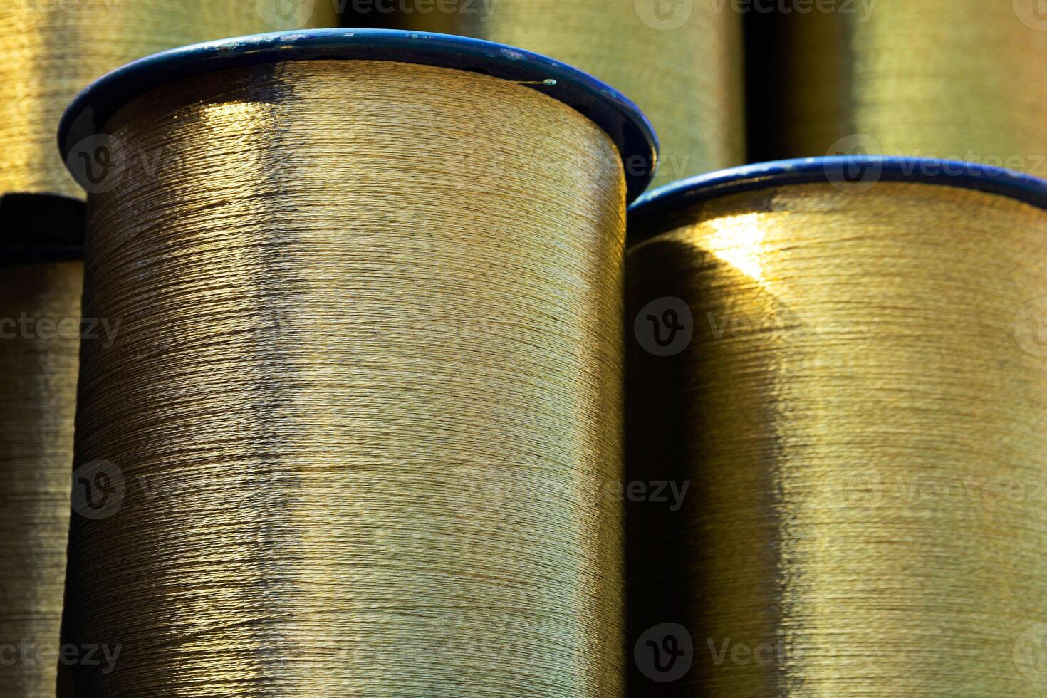 Spiral brass wire wound on a spool, ready for shipment. Copy space photo