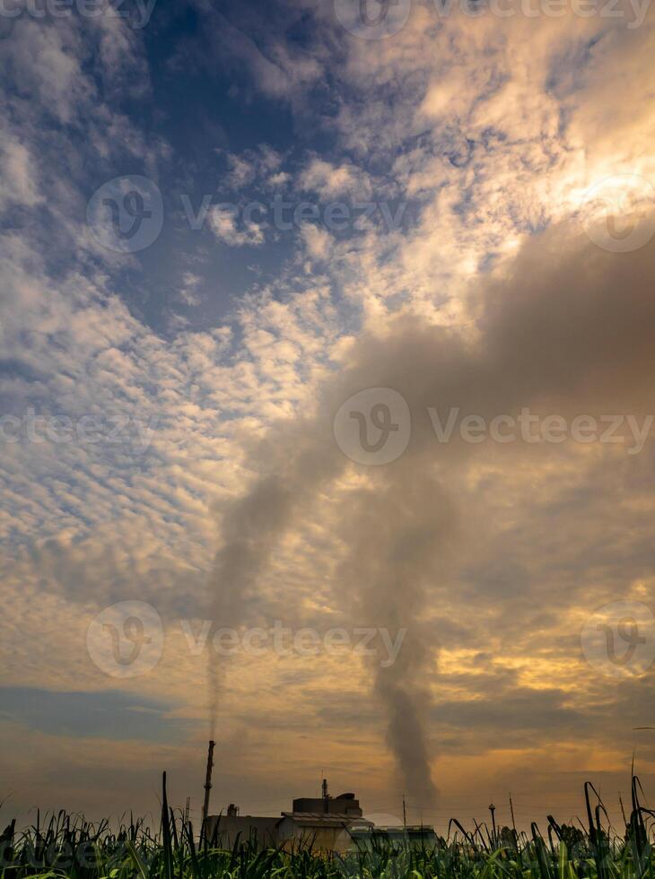 Smoke from the boiler stack and the vapor from a cooling tower in the power plant photo