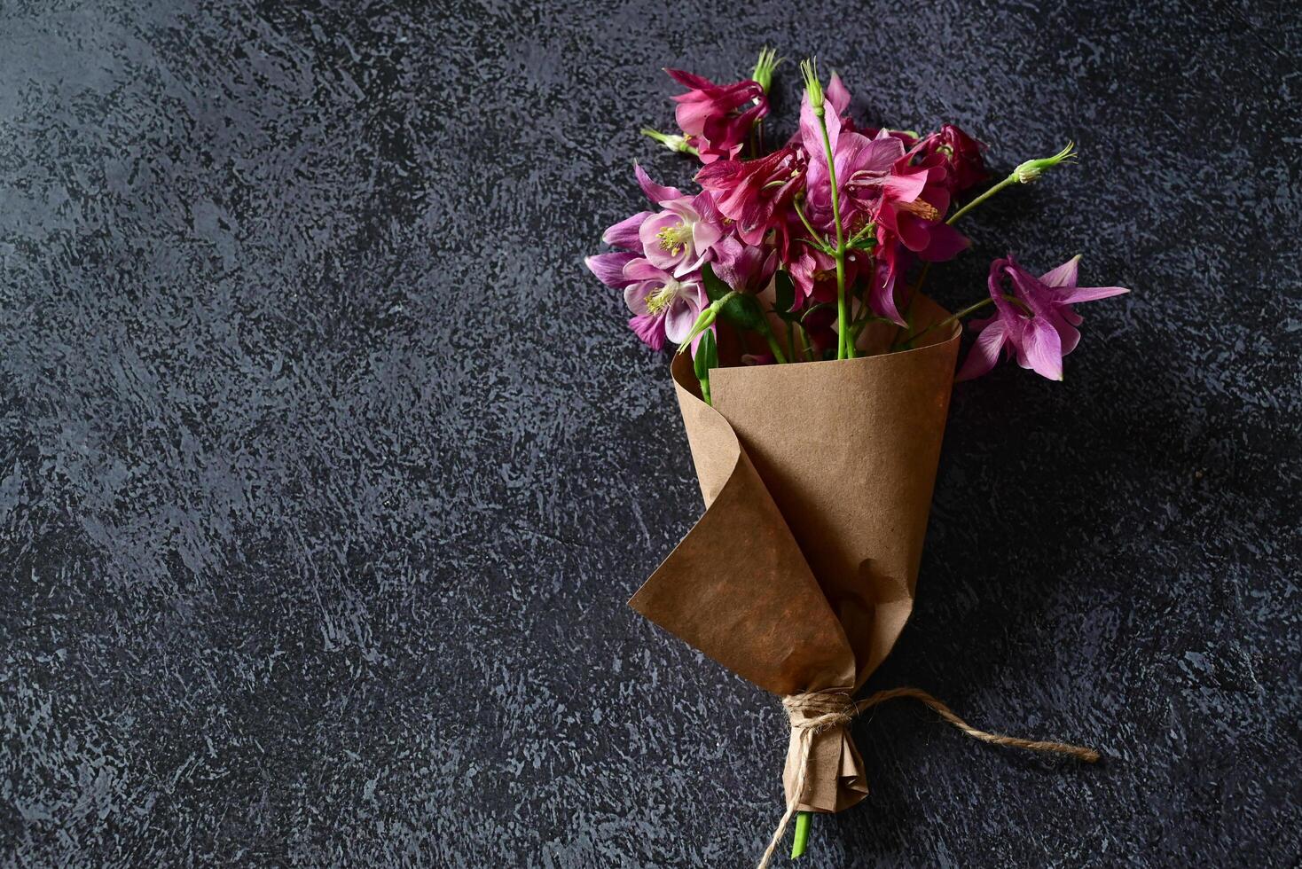 Pink and blue flowers, postcard, kraft, twine. Layout of Women's Day or Mother's Day, St. Valentine's Day, flat, top view. photo
