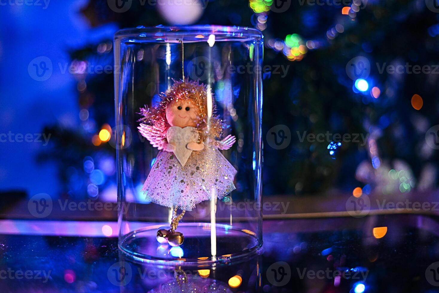 Christmas winter scene is a Christmas angel on a dark blue background with space to copy. photo