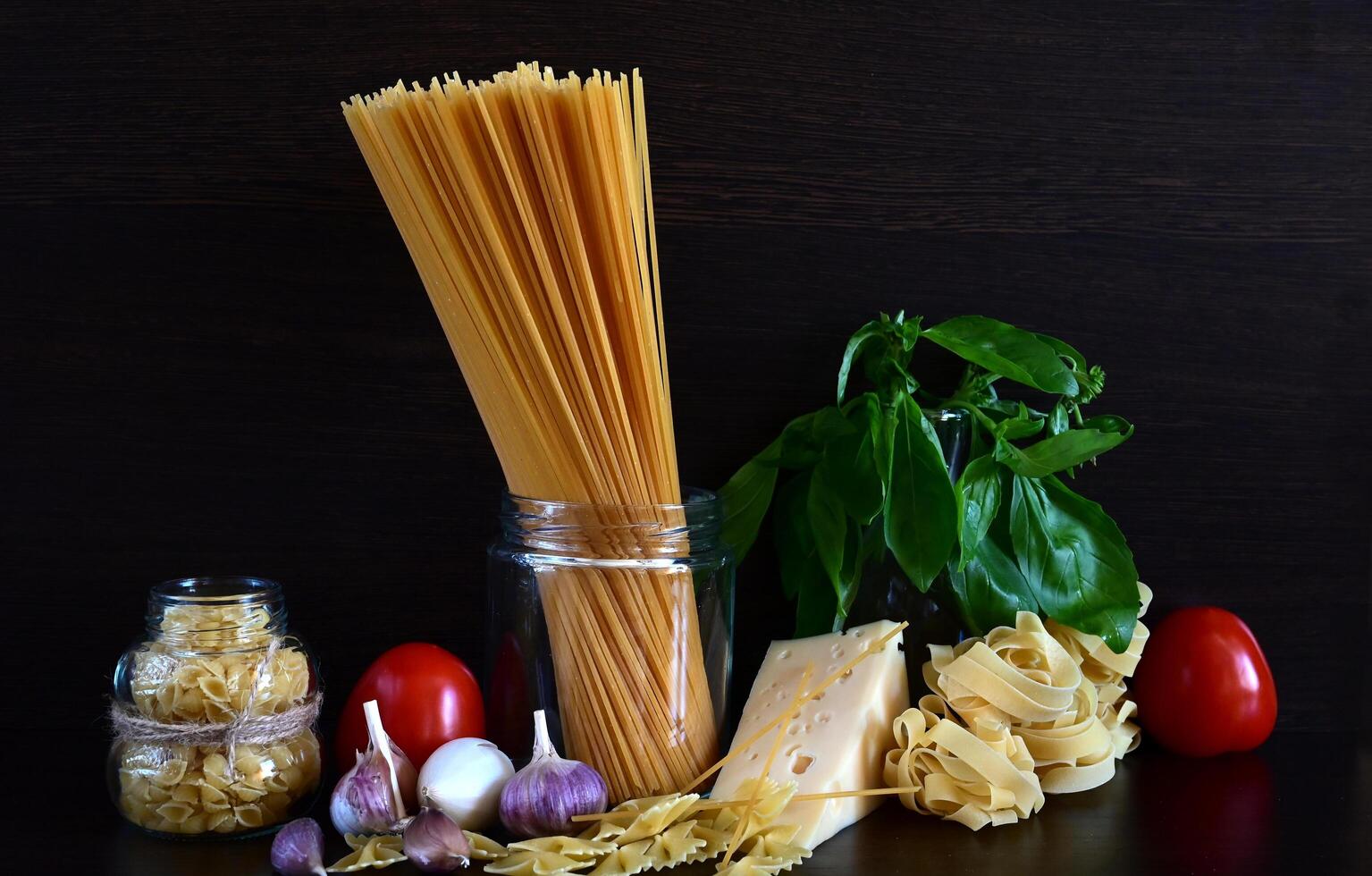 On the left side of the image, there is a bunch of spaghetti tied together with a string photo