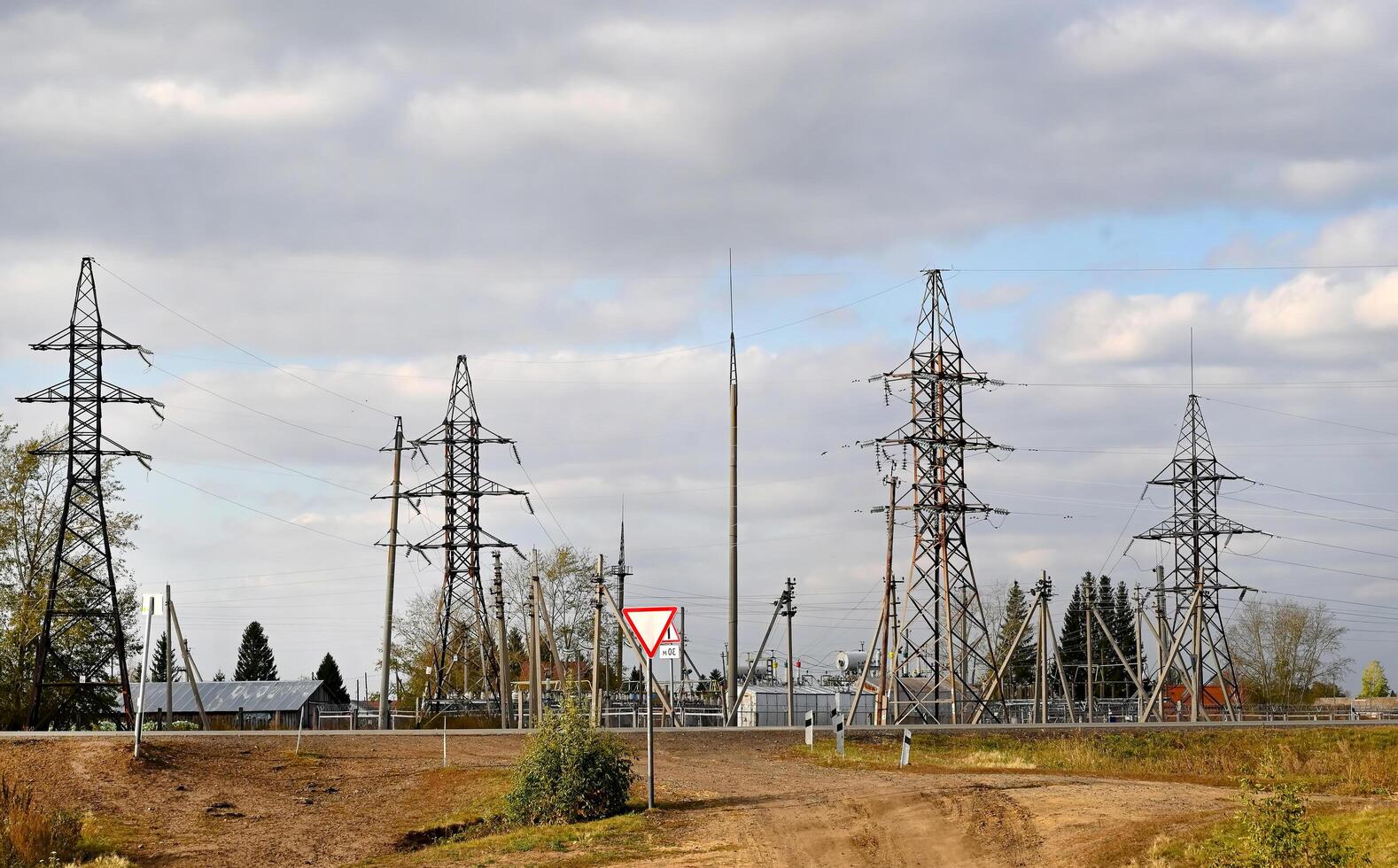 View of power lines near residential buildings. Electricity. photo
