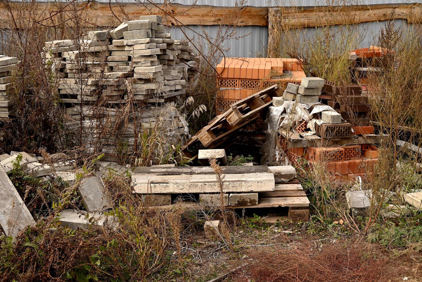 Construction waste. A pile of construction waste. Building rubble and stones. Abandoned garbage, junk, garbage piled up near the building. Street scene. Recycling industry. Ecology. Not Ecology. photo