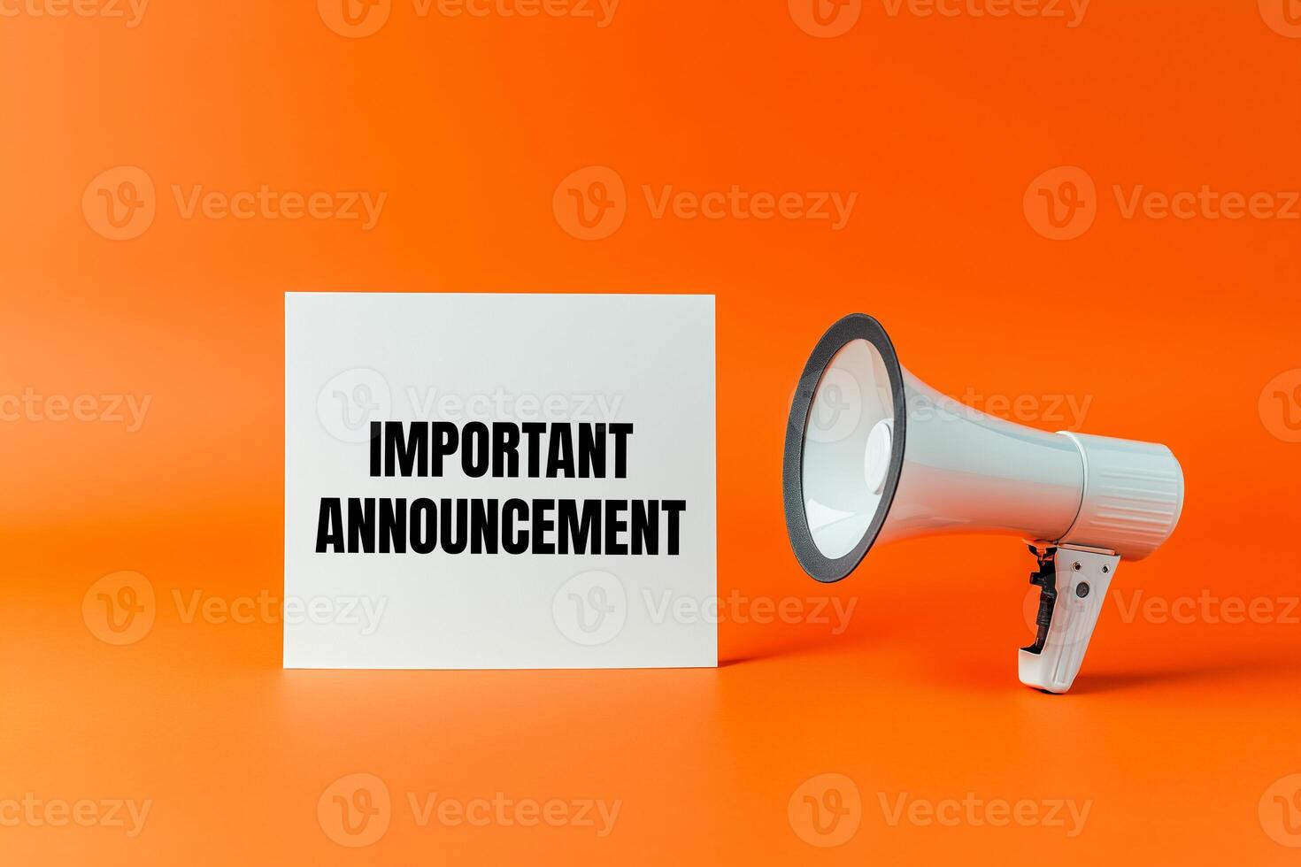 Important announcement message written on white card with a megaphone on orange background photo