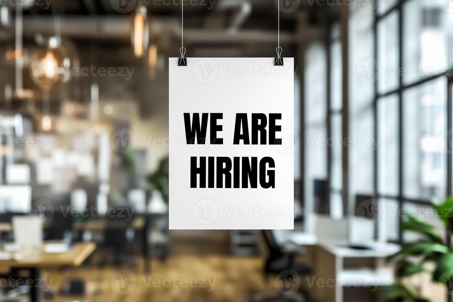 We are hiring message written on white paper in office photo