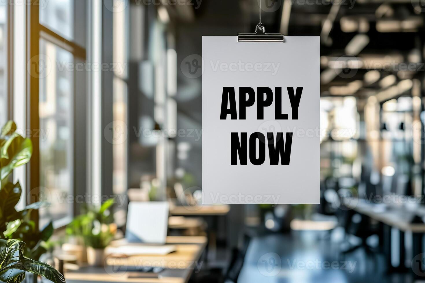 Apply now message written on white paper in office photo