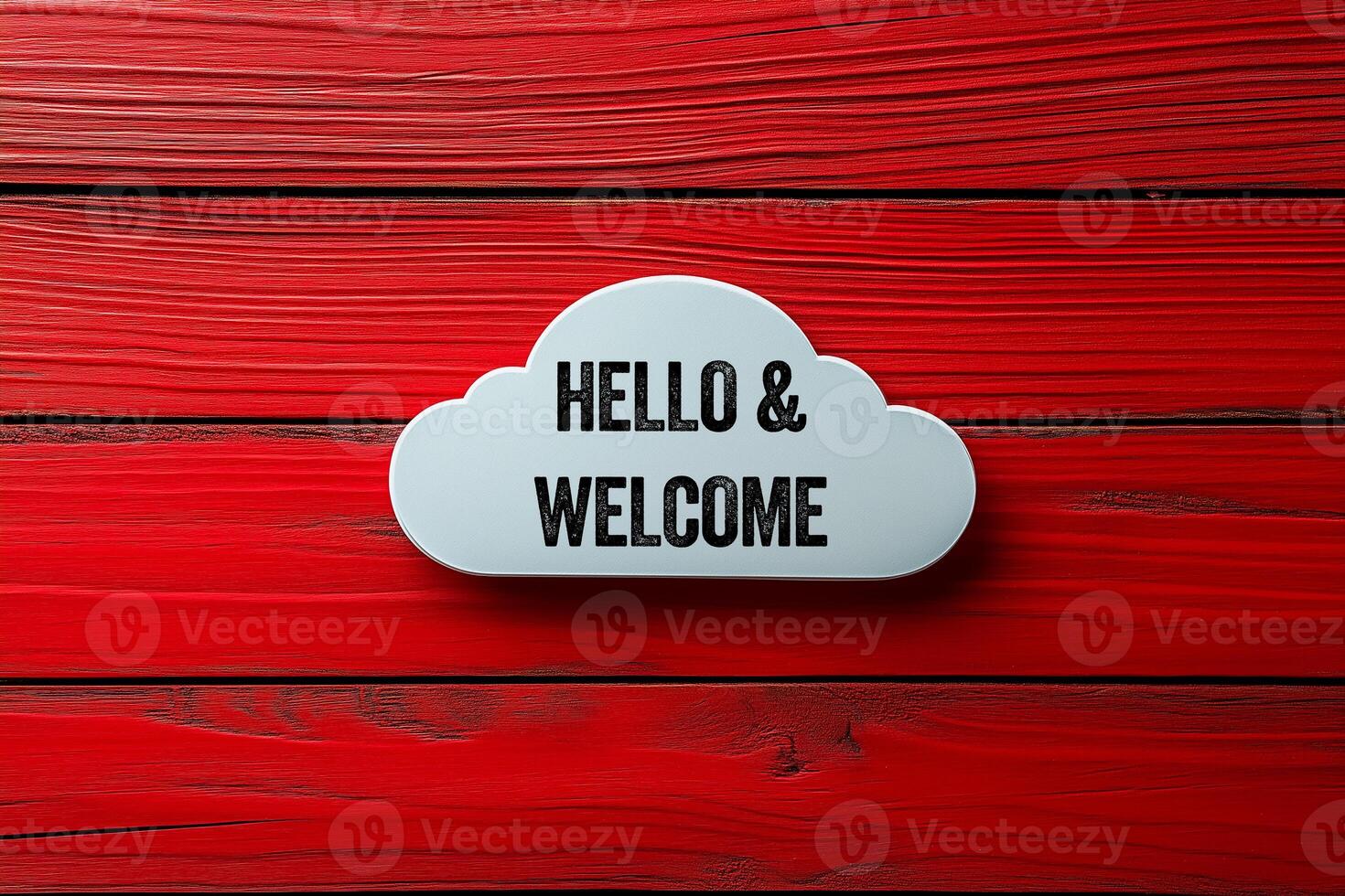 Hello and welcome message written on white cloud shape on red wooden background. Conceptual hello and welcome symbol. Copy space. photo