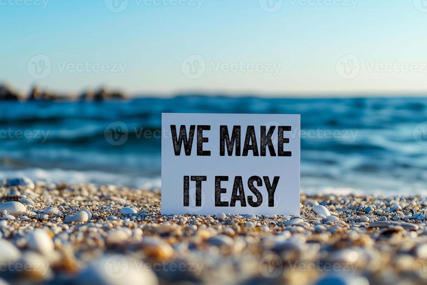 We make it easy message written on white card on sea background. Conceptual we make it easy symbol. Copy space. photo