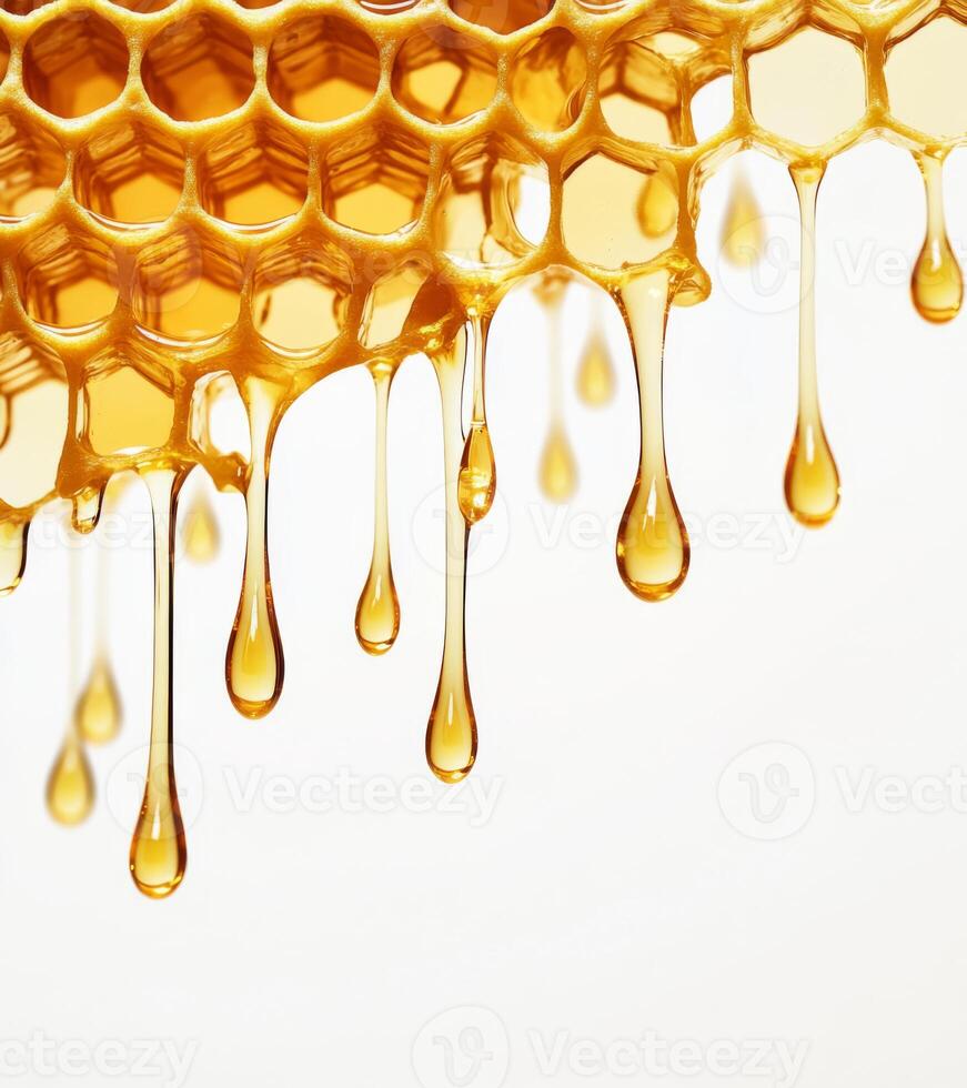 Golden honey drips from honeycomb, showcasing natural sweetness and texture of fresh honey. image captures rich, amber color and intricate hexagonal pattern of honeycomb photo