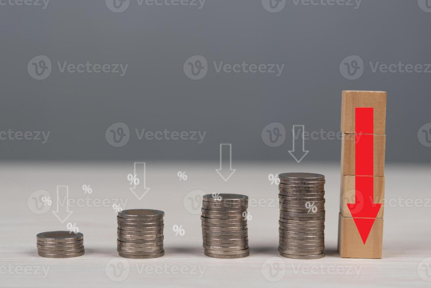 A stack of coins and a red arrow pointing up photo