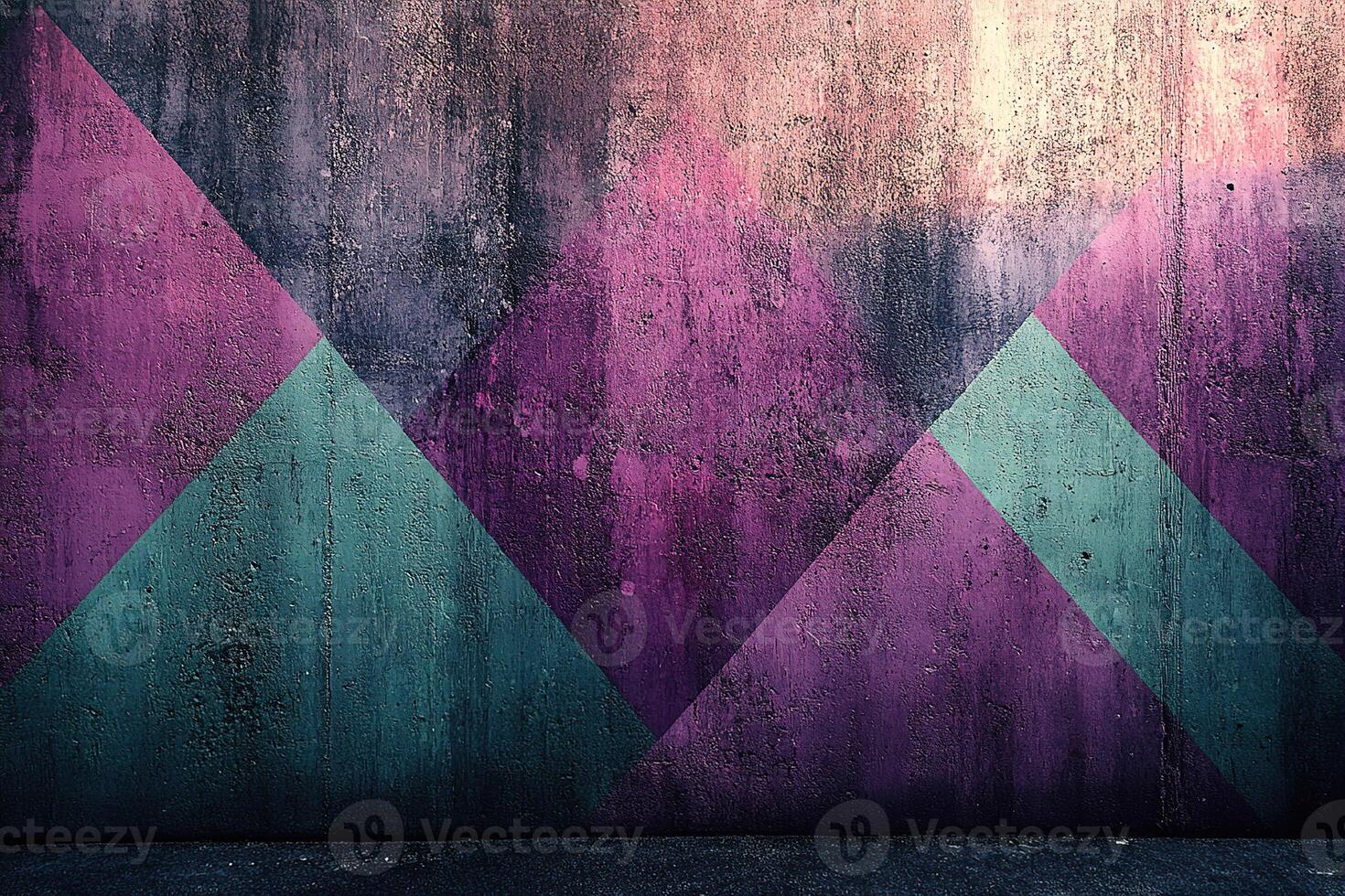 A wall with a colorful design of triangles and squares photo