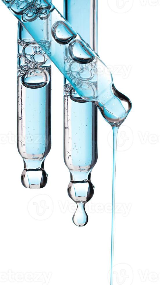 Set pipette serum blue drop with clear liquid niacinamide, hyaluronic on a white isolated background photo