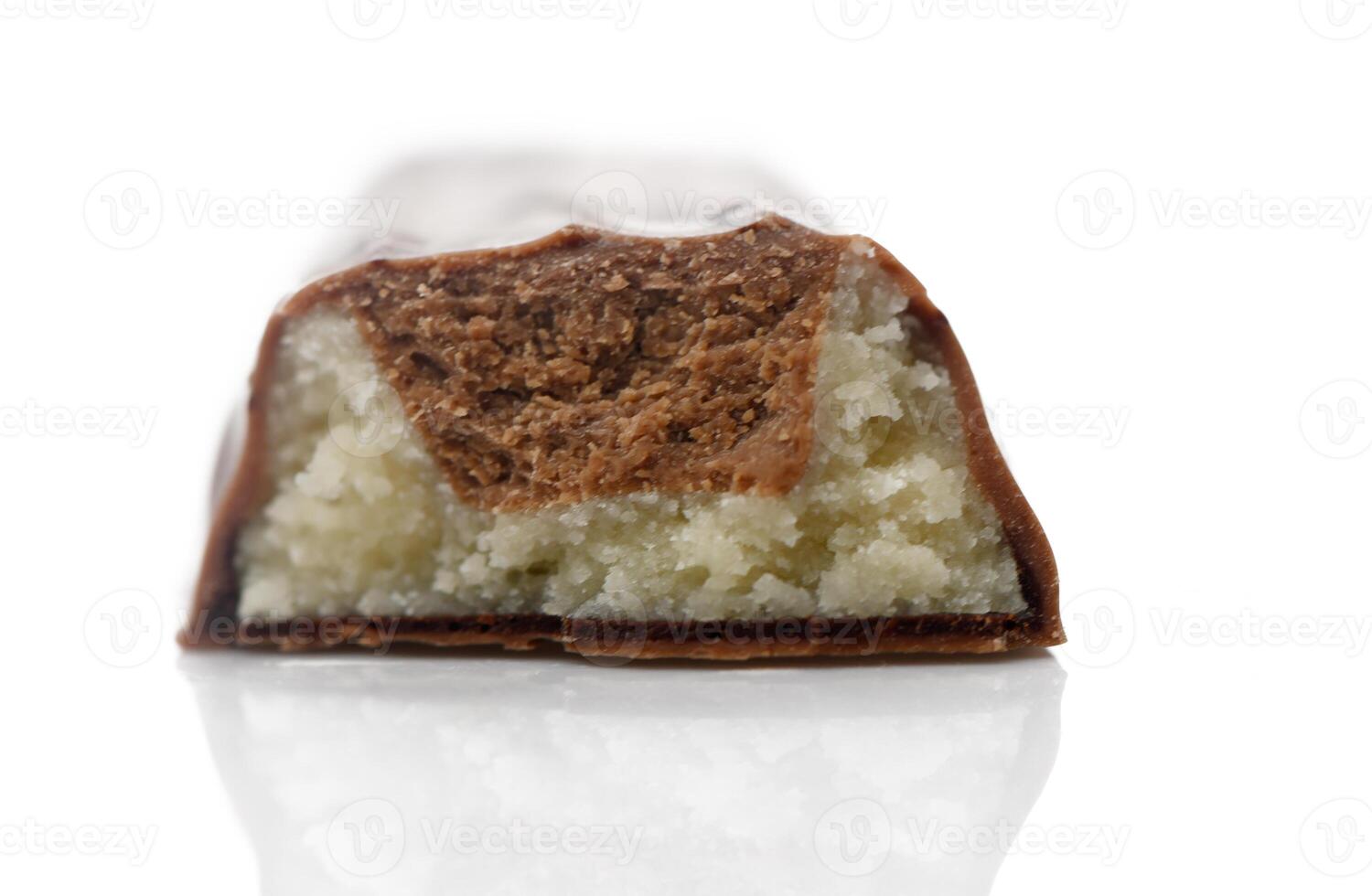 Decadent chocolate bar revealing soft, creamy filling with almond flavor in elegant setting photo