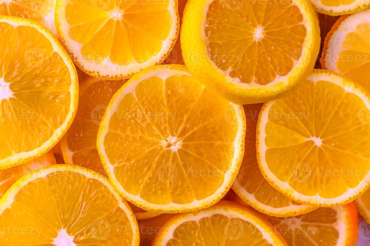 Bright and refreshing citrus slices stacked together in a vibrant pattern photo