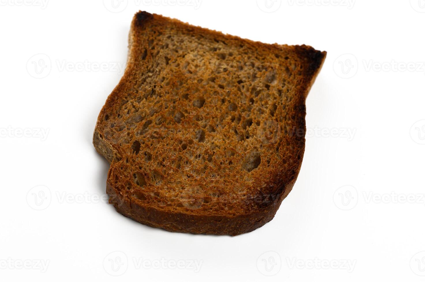 Perfectly toasted slice of whole grain bread on clean white background ready for delicious toppings photo