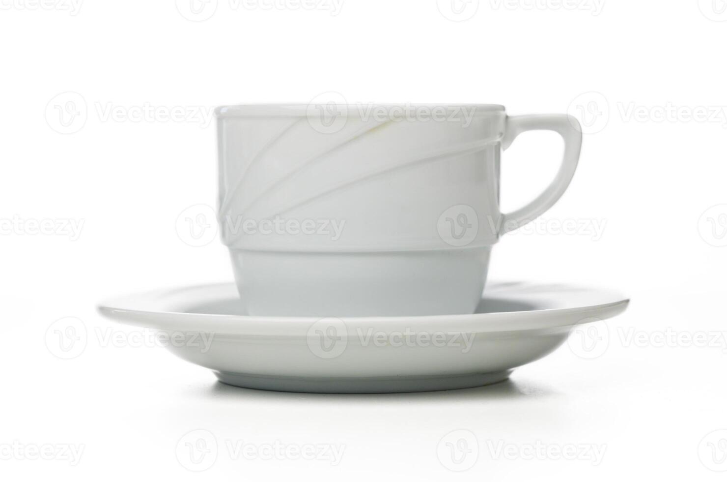Elegant white cup and saucer captured in minimalistic style with soft lighting photo