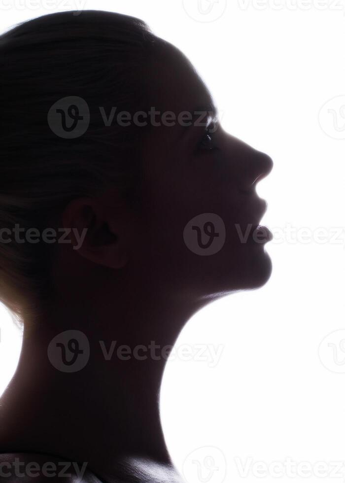 Silhouette of a woman s face on a white background photo
