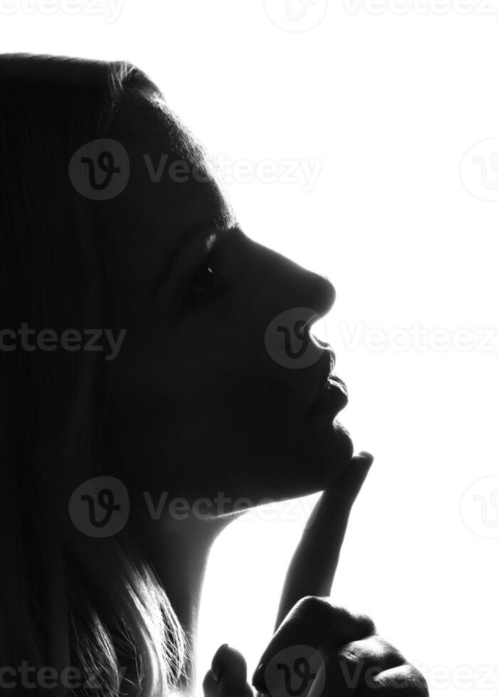 Silhouette of a woman s face on a white background photo
