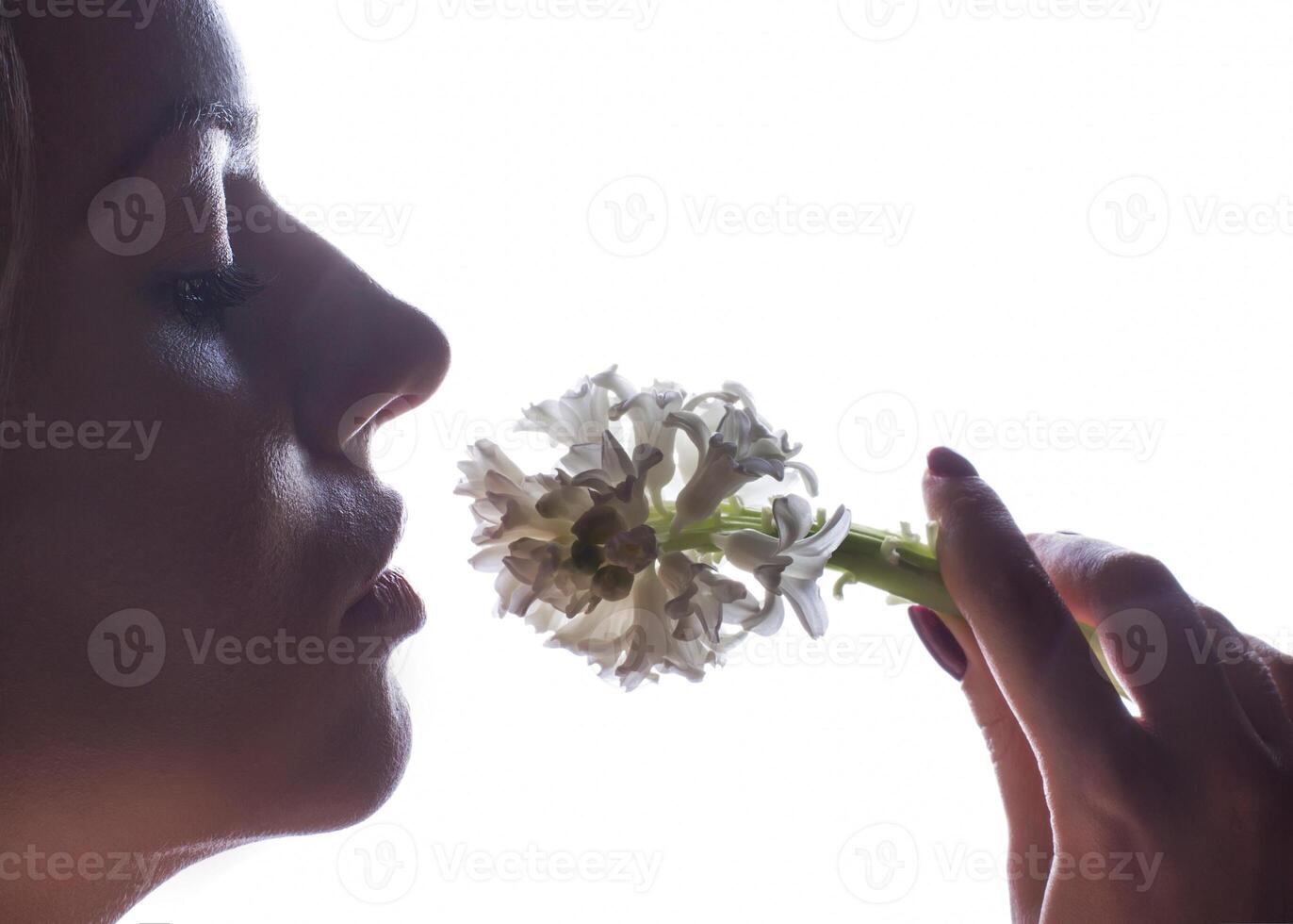 Silhouette of a woman s face on a white background photo