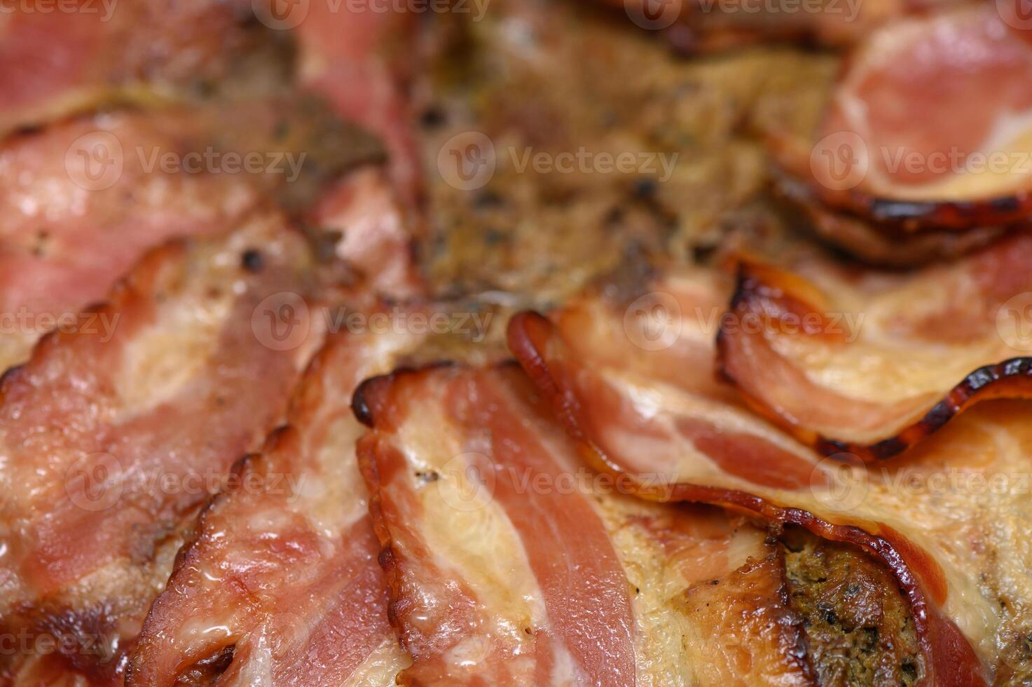 Sizzling slices of perfectly cooked bacon on a golden-brown crust ready for breakfast delight photo