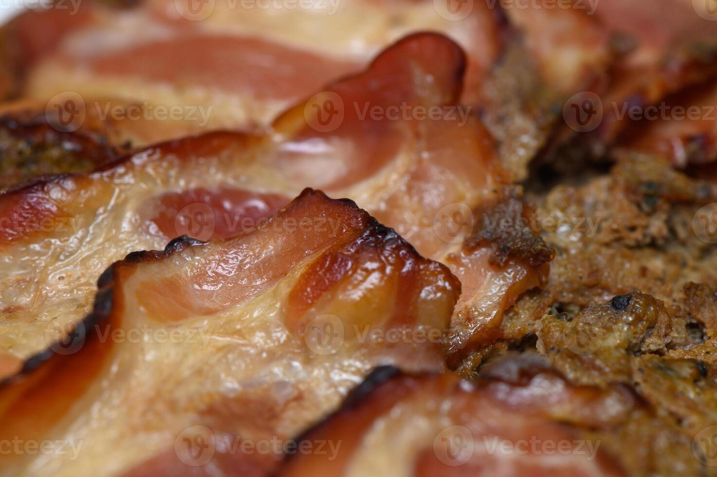 Sizzling close-up of freshly cooked bacon on a sunny morning breakfast plate photo