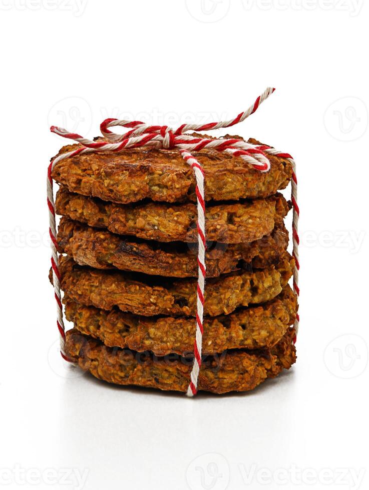 Delicious stacked cookies tied with red and white string for a delightful gift. photo