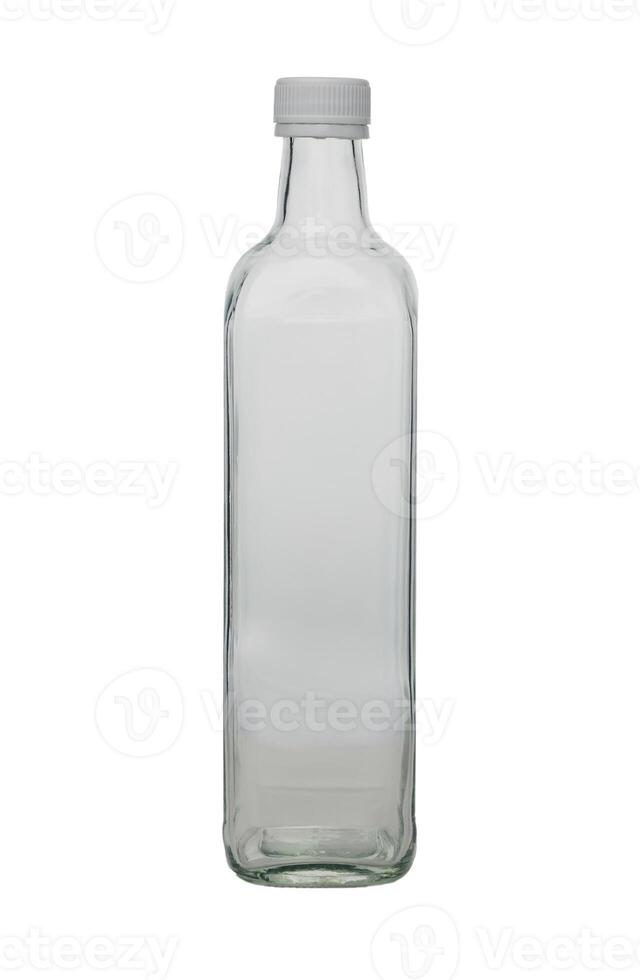Clear glass bottle standing upright on a neutral background, showcasing simplicity and elegance in design photo