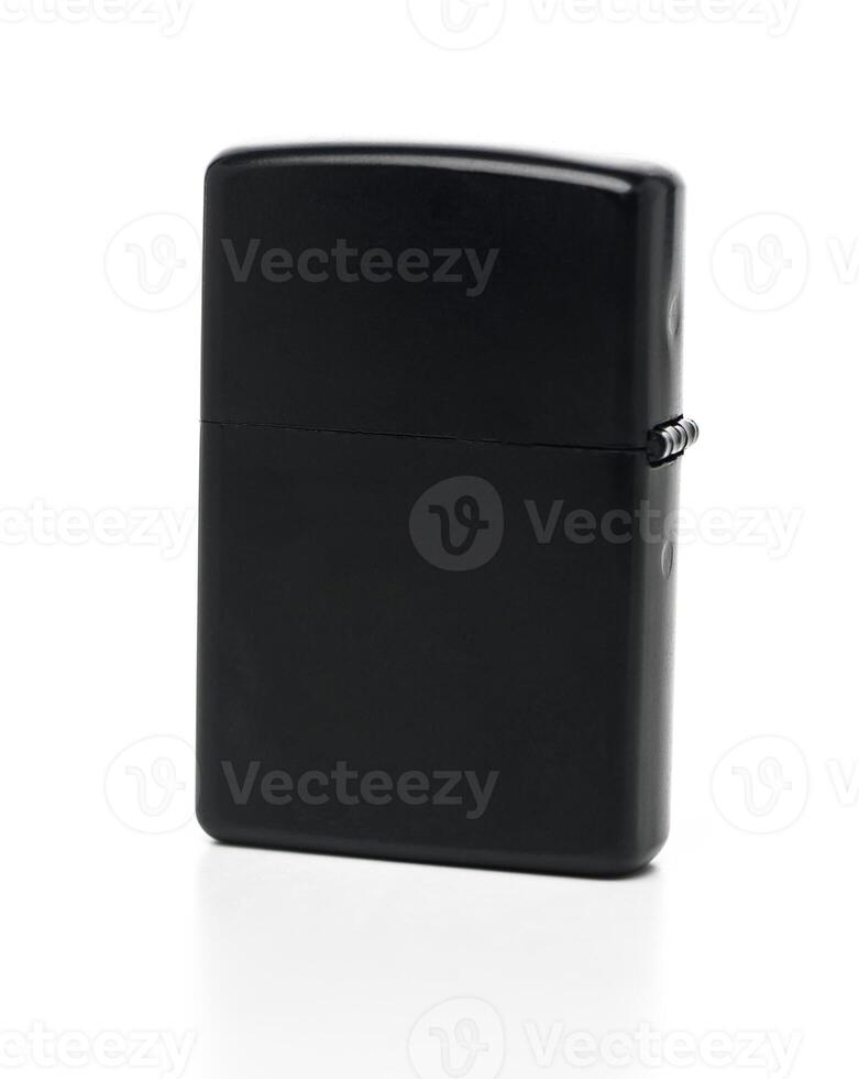 Classic black lighter resting on a white surface, symbolizing simplicity and functionality in design photo