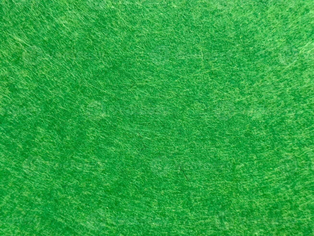 Close up of vivid green textured surface with circular patterns photo