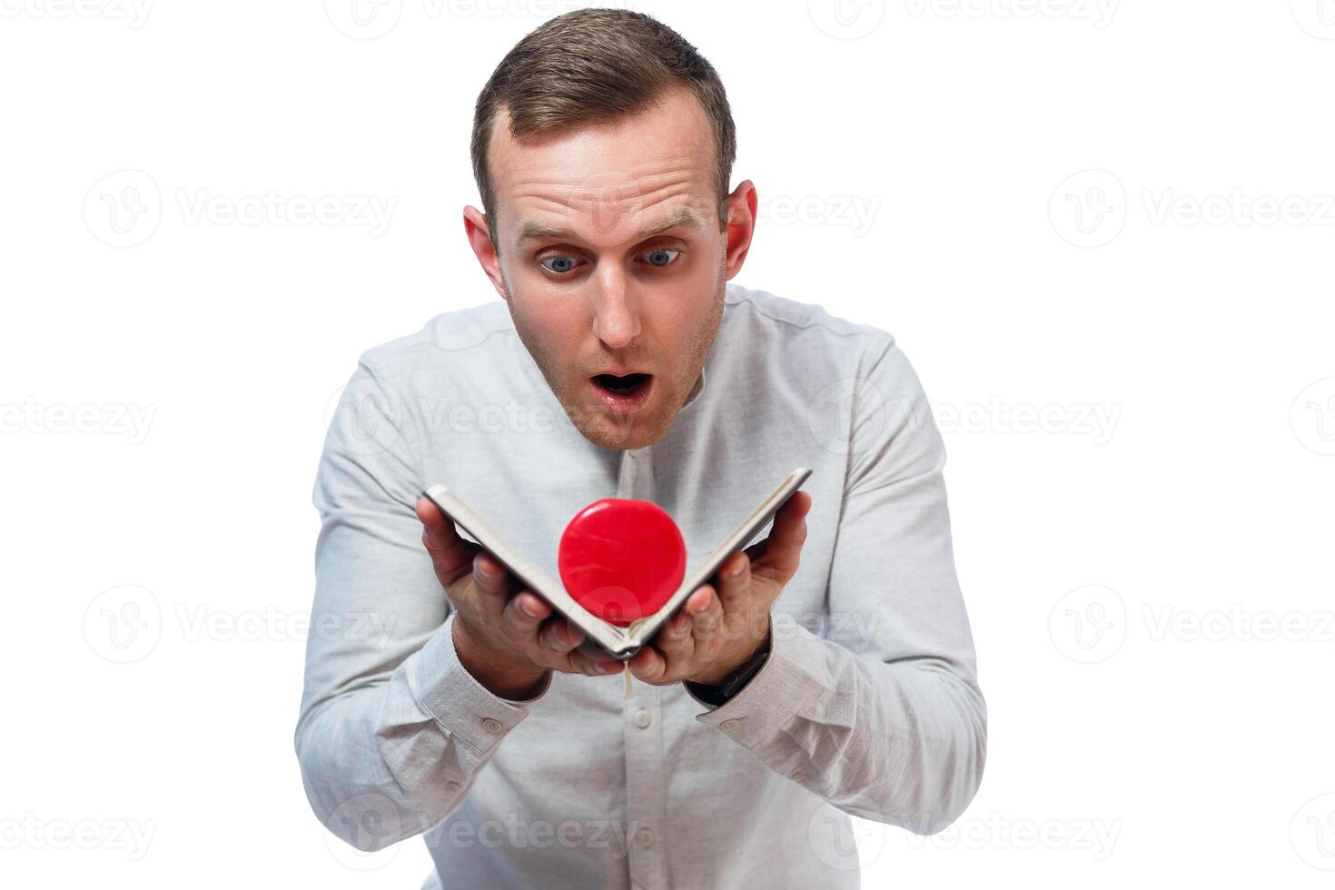 Caucasian man businessman, a teacher mentor. He is holding a diary and red dumbbell. He is wearing a shirt. Emotional portrait. Isolated on white background photo