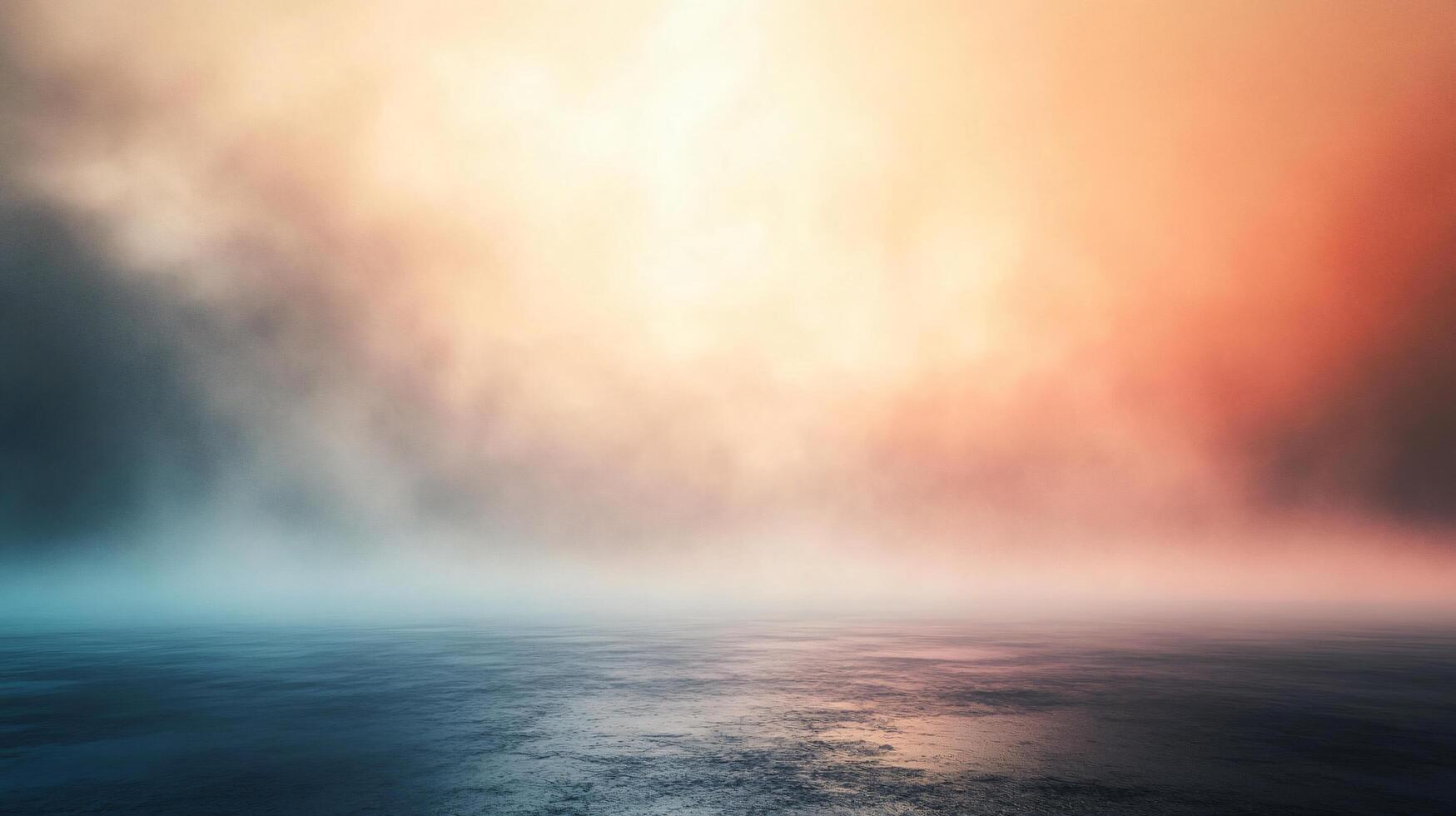 Blurry image of a foggy, misty day with a bright orange and blue sky. The sky is filled with clouds, and the water is calm. Scene is serene and peaceful, with the water photo