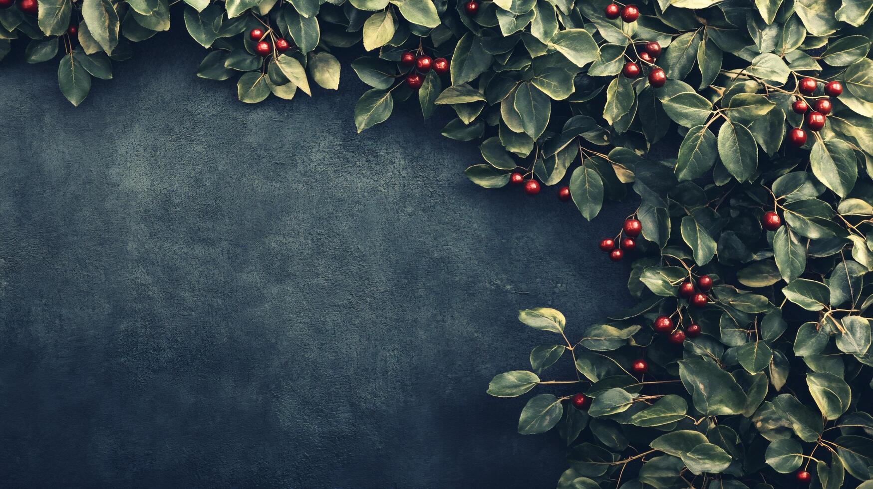Blue background with a green leafy border and red berries. The image has a festive and cheerful mood photo