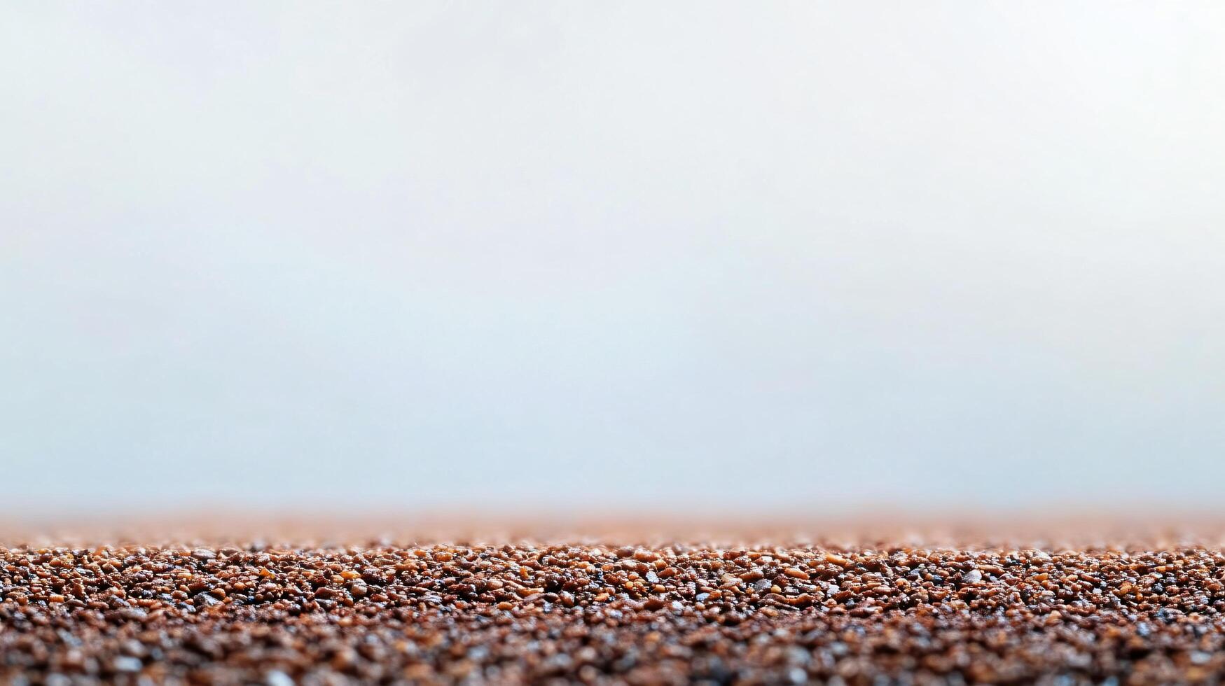 Vast, open field with a few scattered brown specks. Scene is serene and tranquil, as the viewer is left to imagine the vastness of the field and the peacefulness of the scene photo