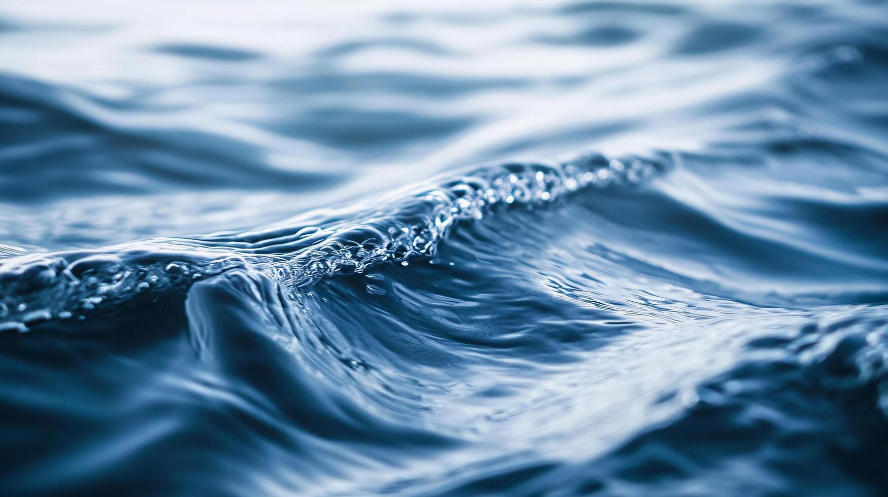 Wave in the ocean with a lot of water. The water is very blue and the wave is very large. Scene is calm and peaceful, as the water is still and the wave is gentle photo